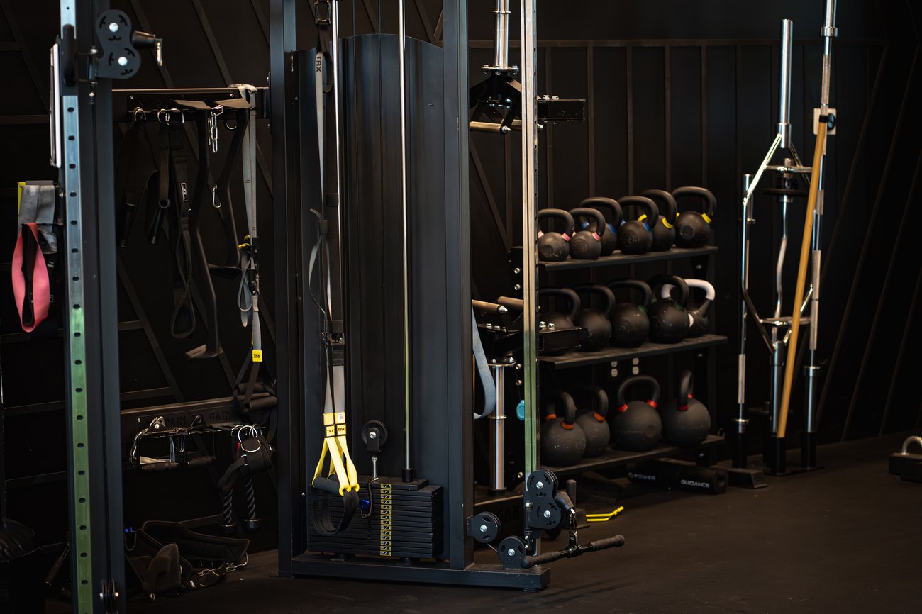 Cable column, TRX straps and kettlebell rack at Fitness Covered