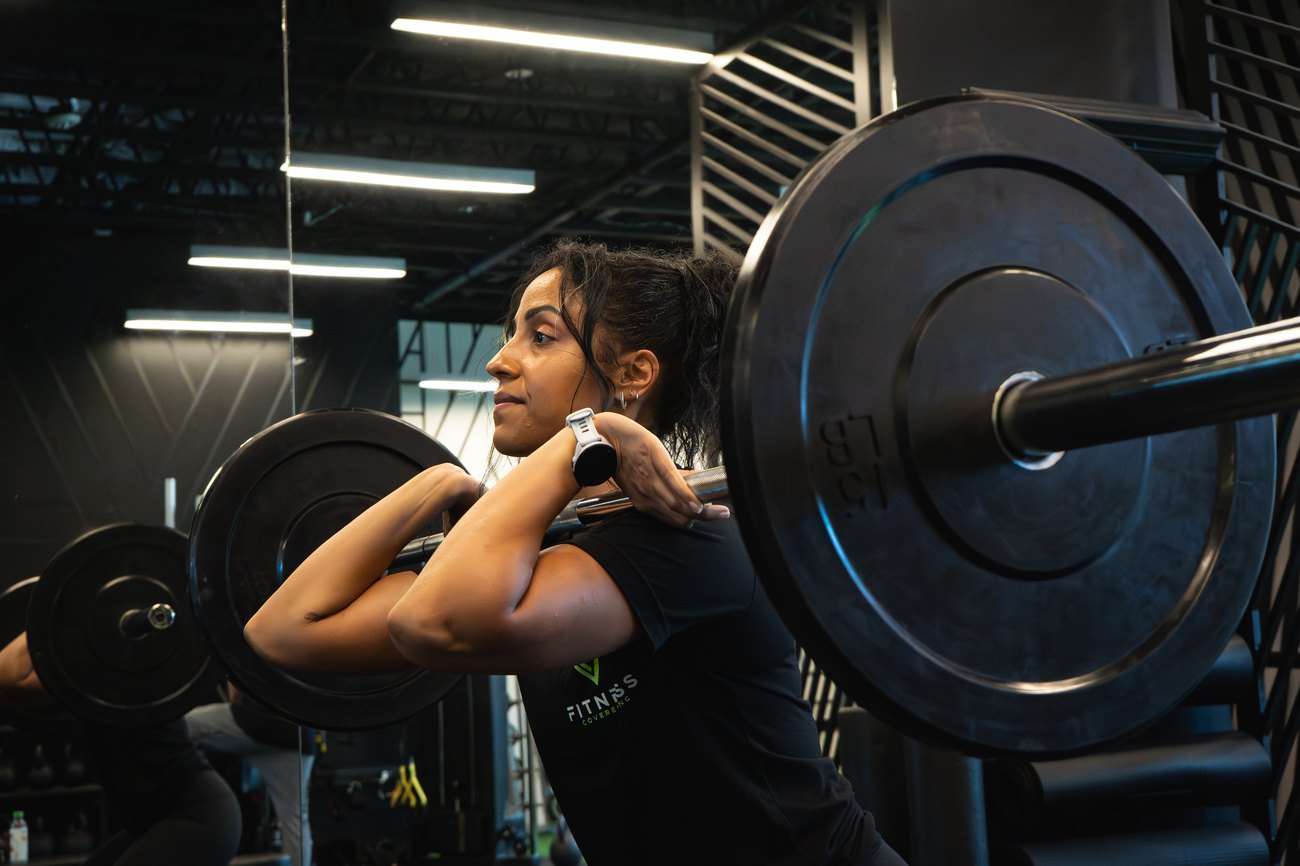 Client performing a front squat at Fitness Covered